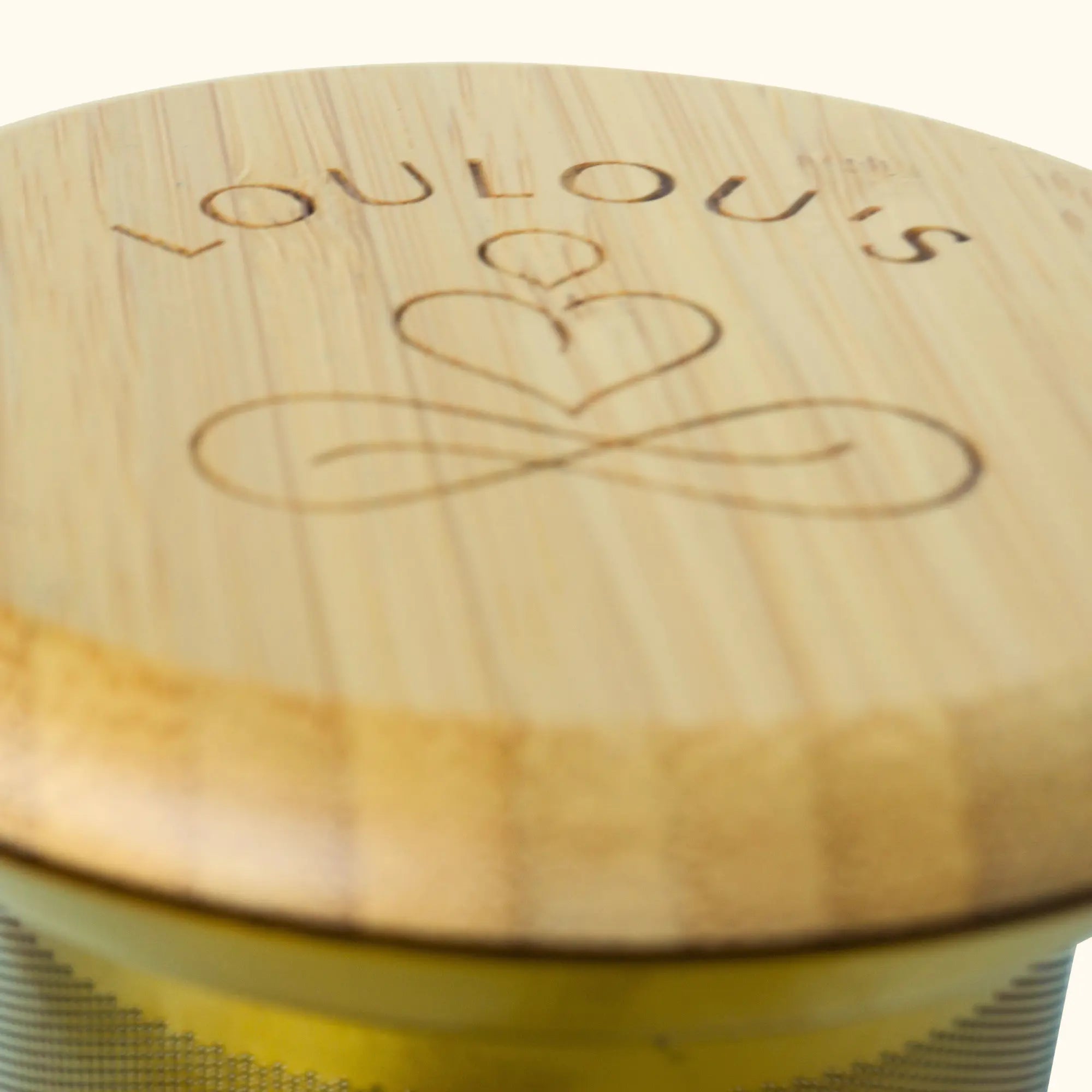 SereniTea infuser bamboo lid close-up with engraved Loulou's Tea logo