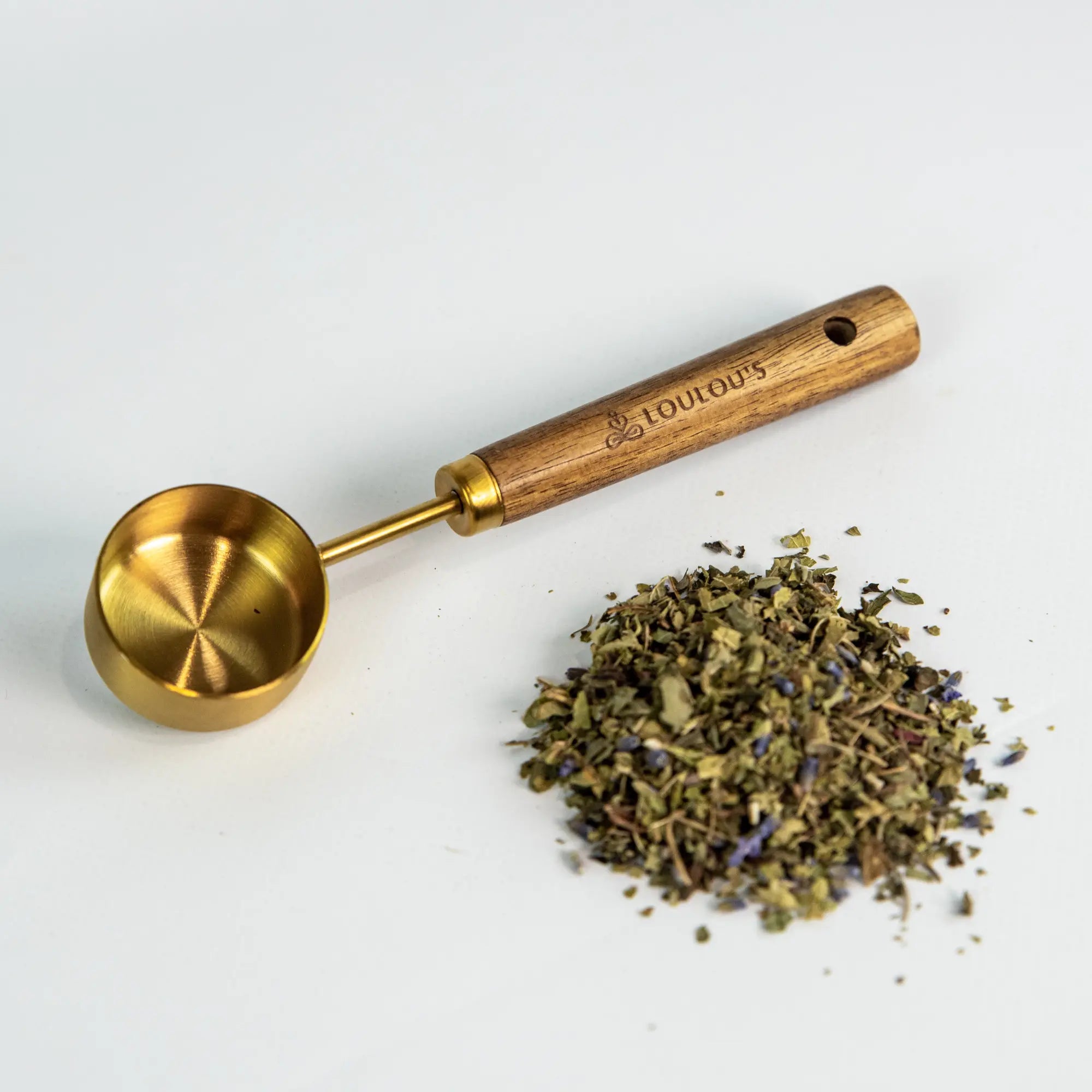 PuriTea stainless steel and acacia wood tea scoop with organic loose leaf blend by Loulou's Tea